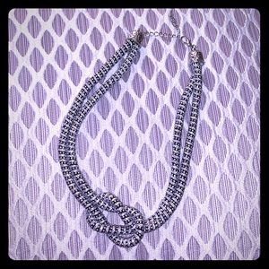 Silver and black statement knot necklace